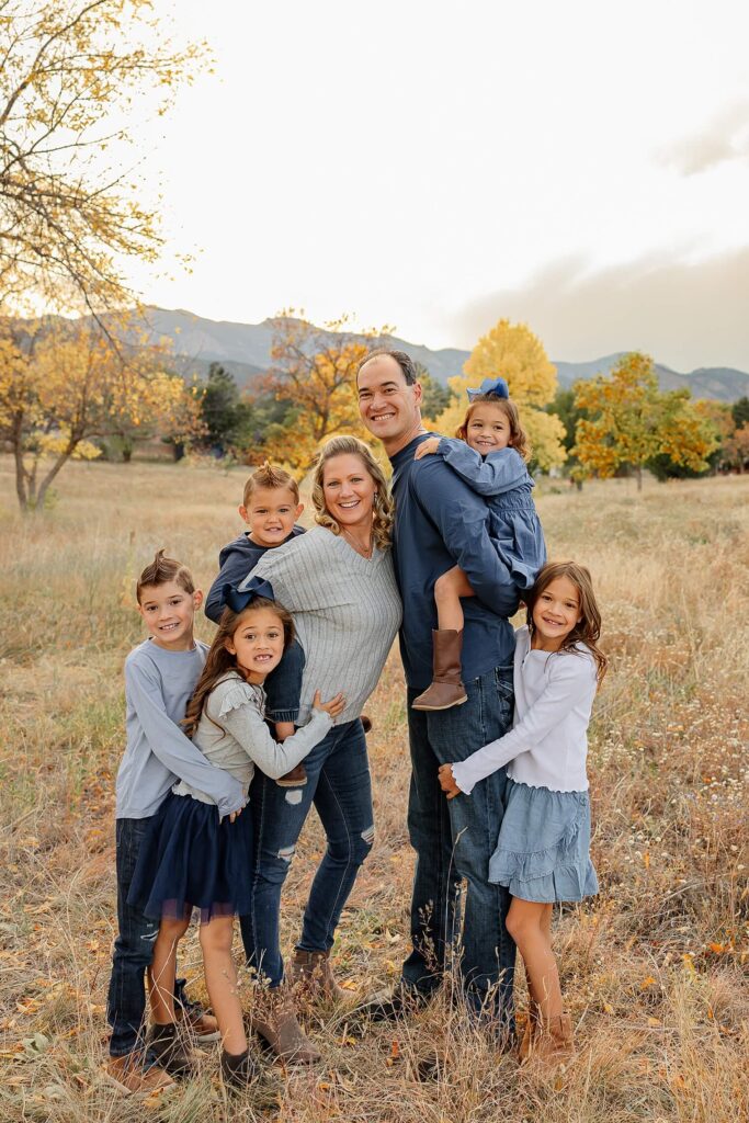 family posing and smiling
