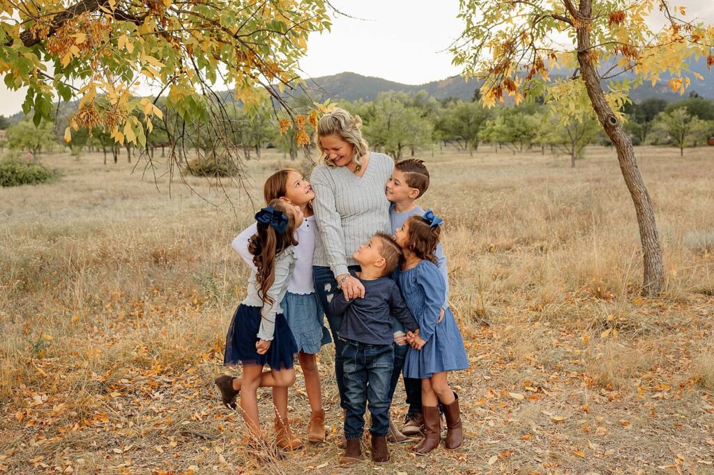 mom and children smiling at each other