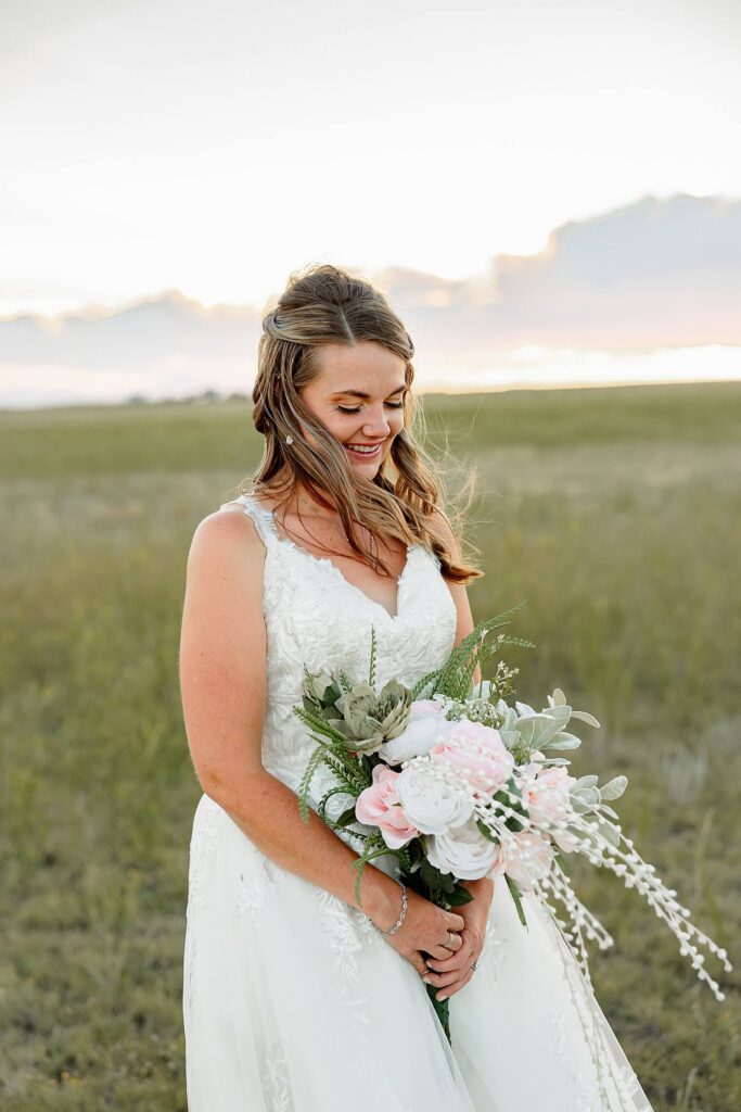 bride looking at flowers