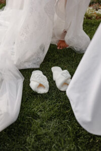 A detail shot of a brides slippers she is changing into. Captured by Michelle, a Colorado wedding & elopement photographer.