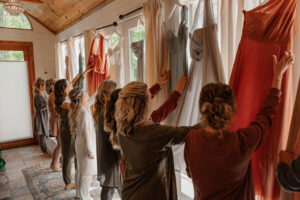 Bride and her Bridal party getting their dresses to put on.