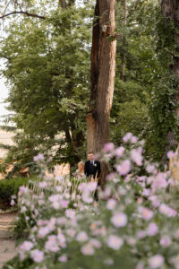 A first touch photo of a bride and groom on their wedding day. Captured by Michelle Betz Photography