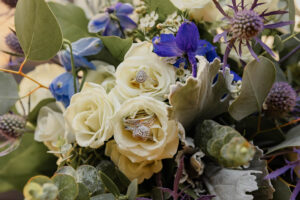 A detail shot of flowers and rings. Taken for a wedding at Black Forest by Wedgewood Weddings.