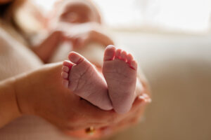 A professional photo of a babies feet. Captured by Michelle Betz Photography